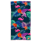 Towel with pattern of pink flamingos against tropical leaves in dark blue and green background